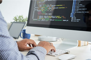 man working on development code